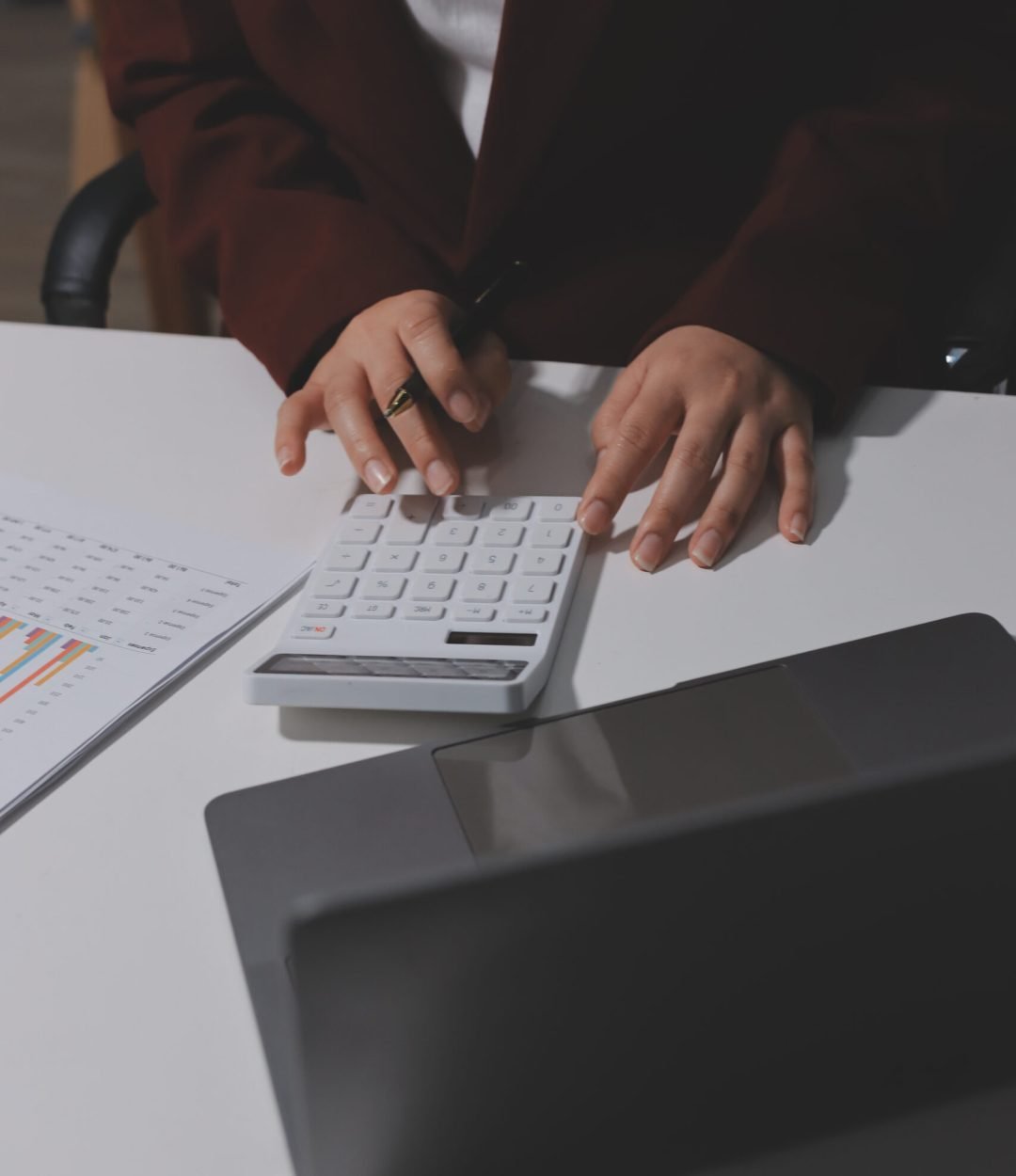 Tax deduction planning concept. Women use a calculator to calculate expenses and taxes to receive tax deductions for personal individual Income. tax return for individual persons.monthly expenses